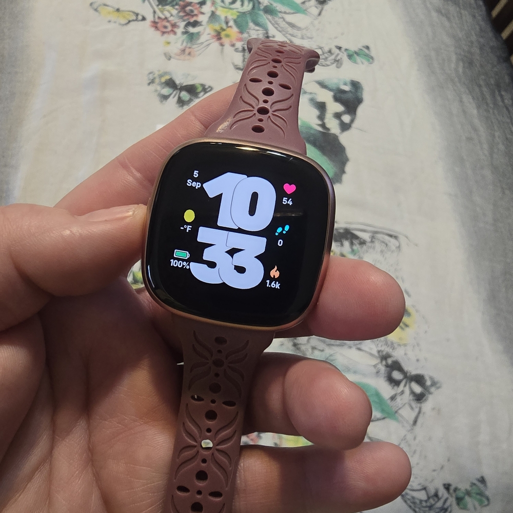 Versa 4 Fitbit Smartwatch with Pink Band and Gold Case